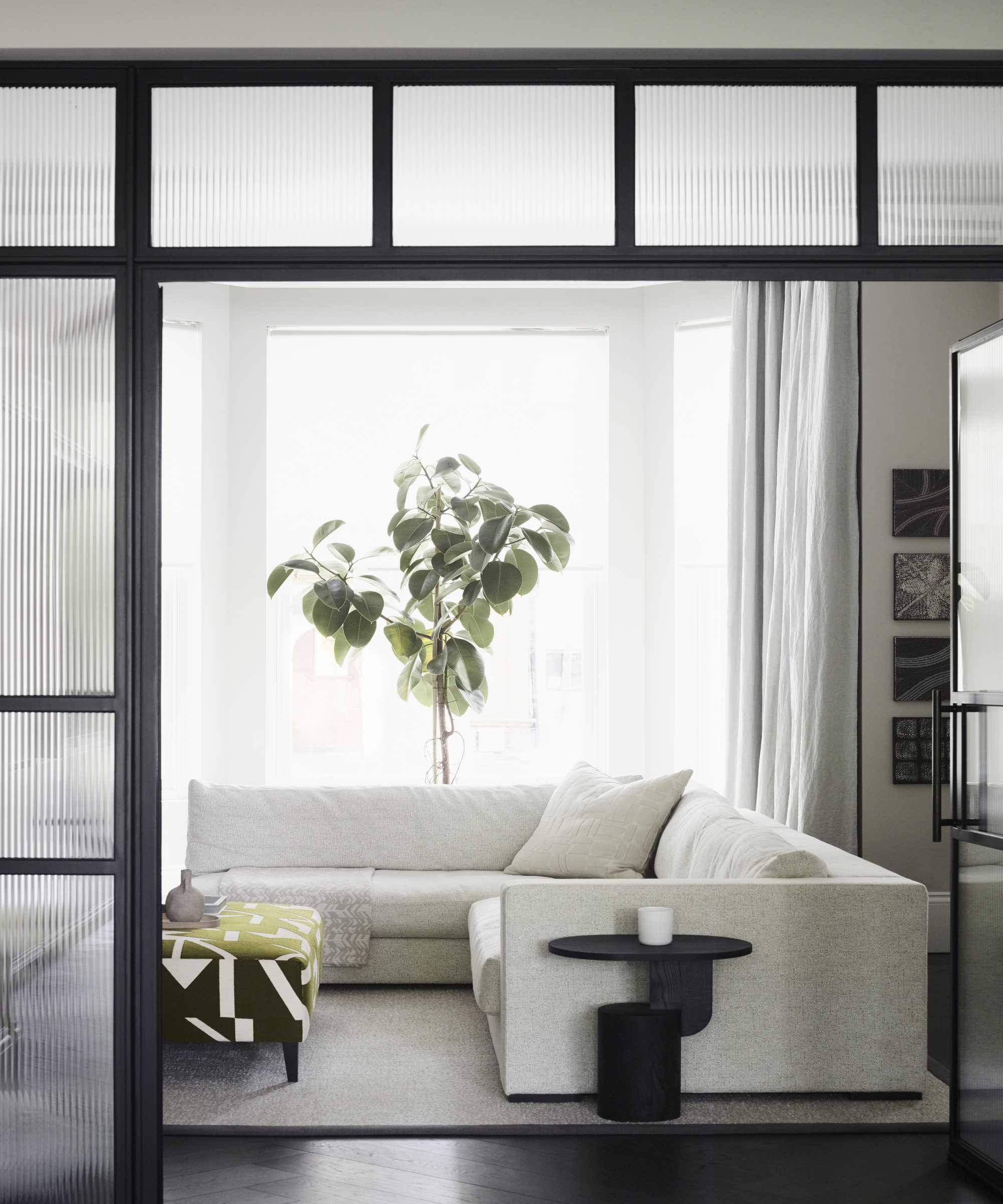 Modern house in a neutral, monochrome palette with pastel pink touches