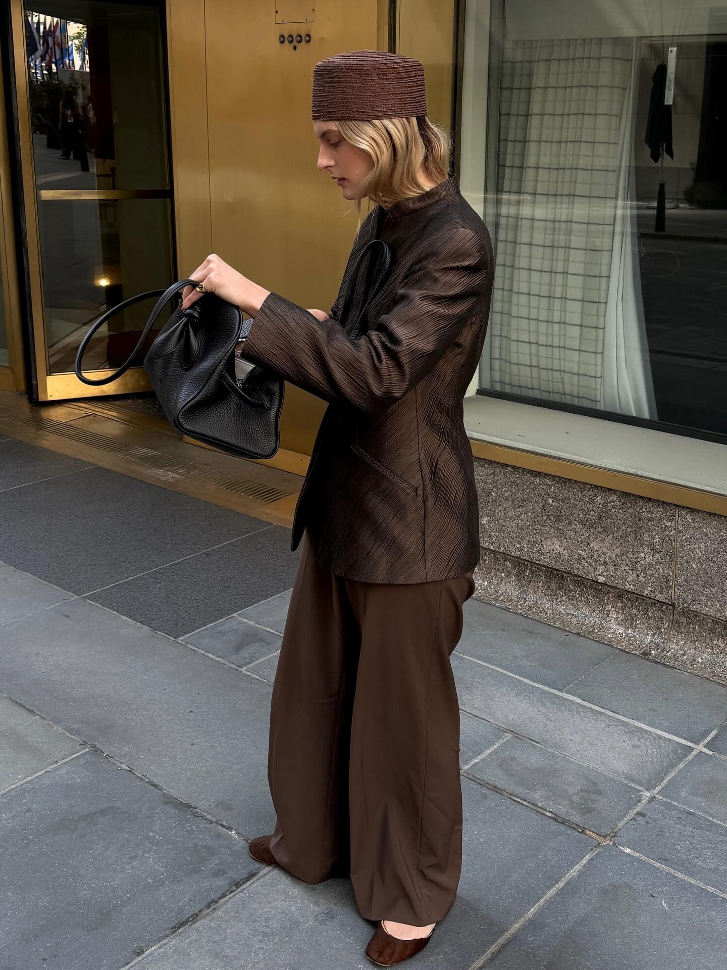 Fashion person Christie Tyler @christietyler wears a winter micro trend. She wears a pillbox hat.