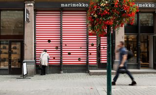 Viewers to take a closer look into its flagship store through peep-hole windows...