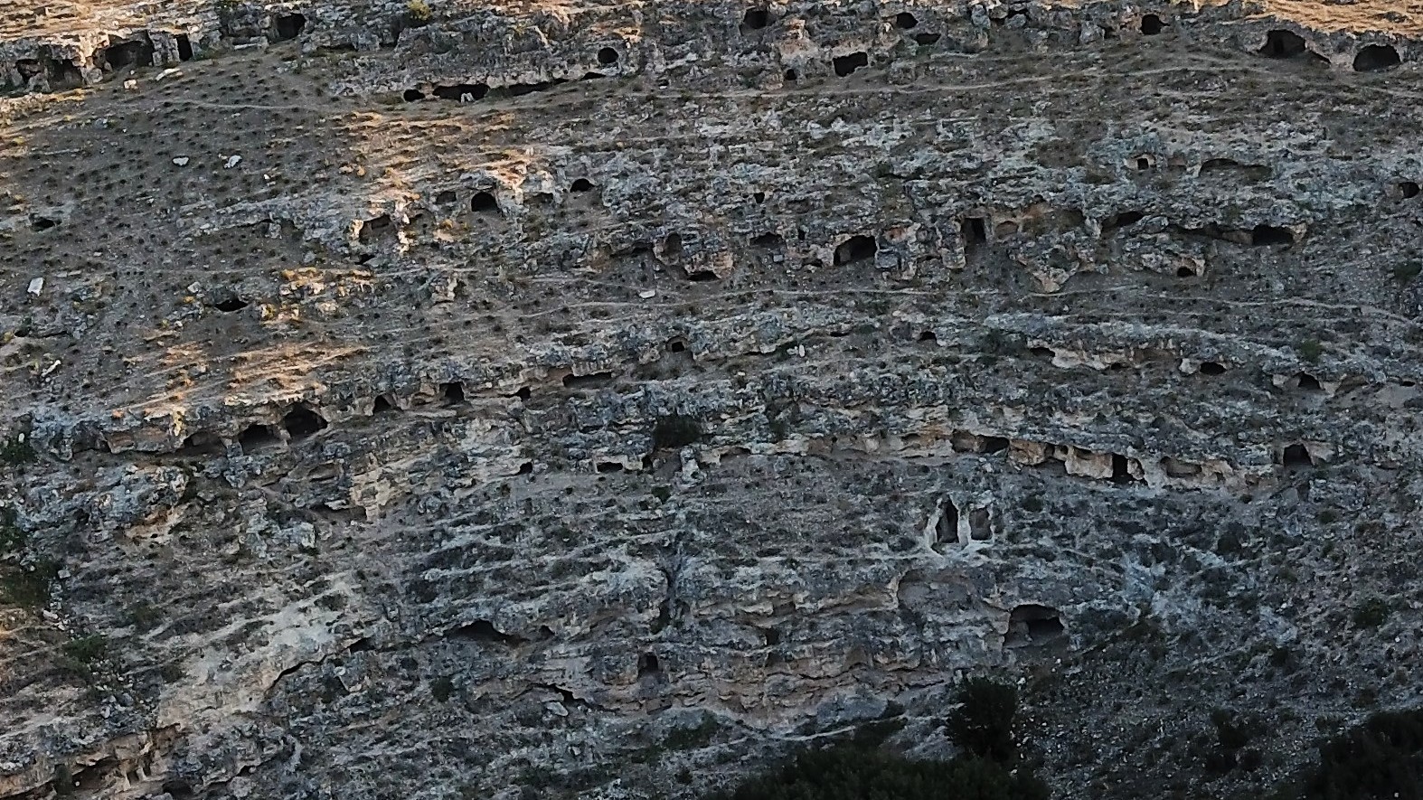 An aerial view of the stone-cut chamber tombs at the necropolis.