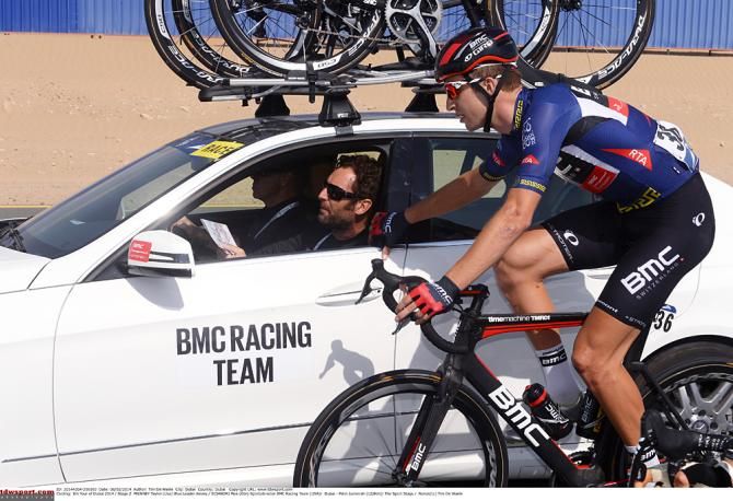 Taylor Phinney gets some advice from the team car