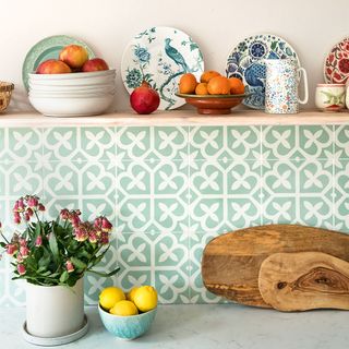wooden kitchen shelf with green tiles