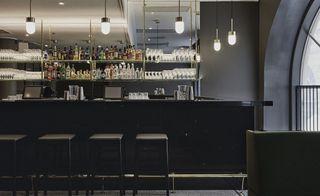Bar counter with bar stools and hanging lights