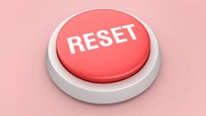 A red reset button against a pink background.