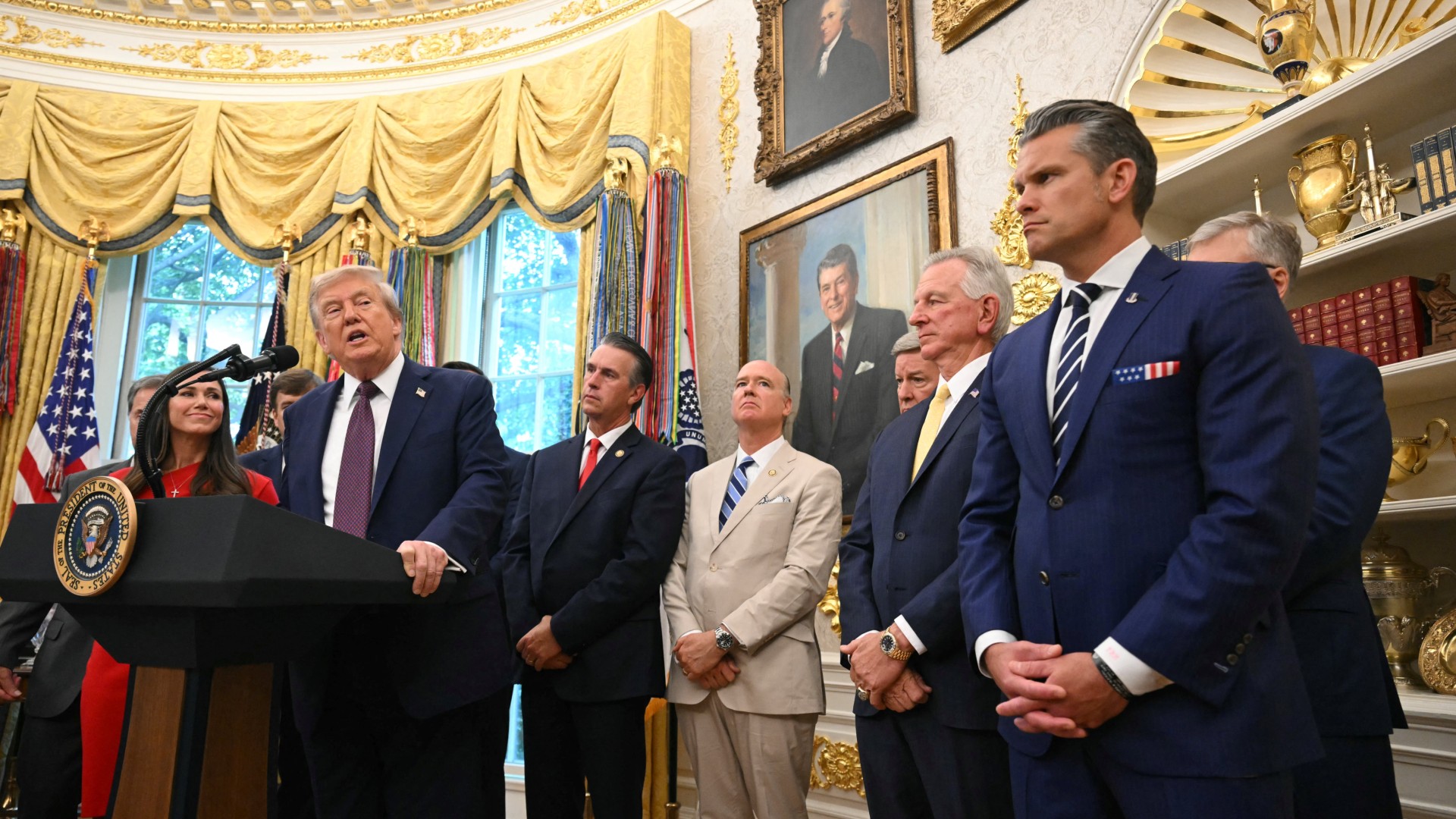 a group of people in suits in a lavish office