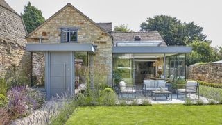 converted coach house with glass box extension