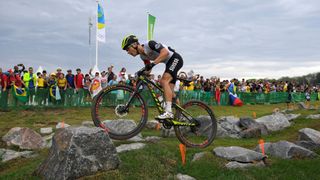 Nino Schurter competing in the 2016 Olympics XCO course