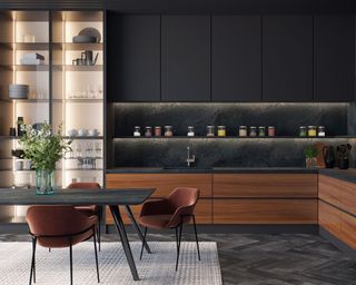 A dark modern kitchen with black quartz worktop, dark dining table, rust-colored velvet dining chairs and clear glass cabinetry with LED light decor