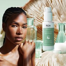 woman's torso and face surrounding by beauty product bottles