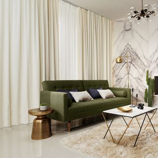 living room with green sofa and cream colour curtain