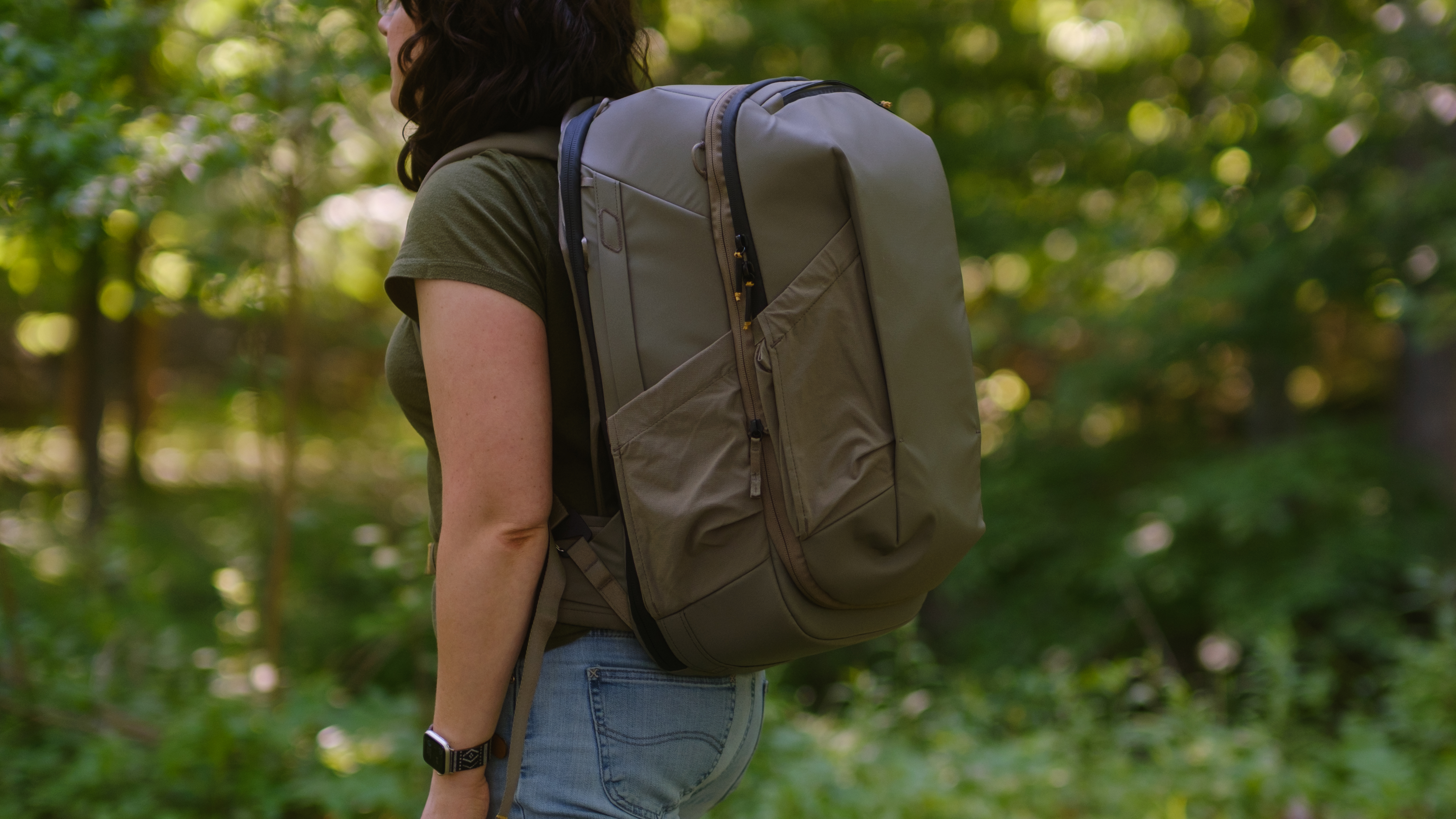 The Peak Design Travel 2-in-1 Backpack outdoors used by a photographer