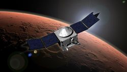a cube-shaped spacecraft with two wing-like solar panels above a cratered reddish-orange planet