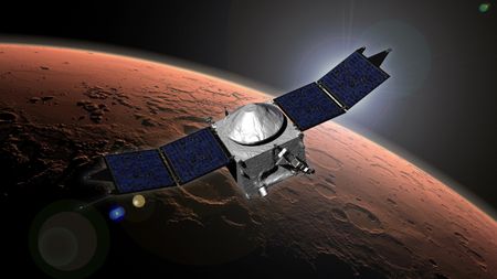 a cube-shaped spacecraft with two wing-like solar panels above a cratered reddish-orange planet