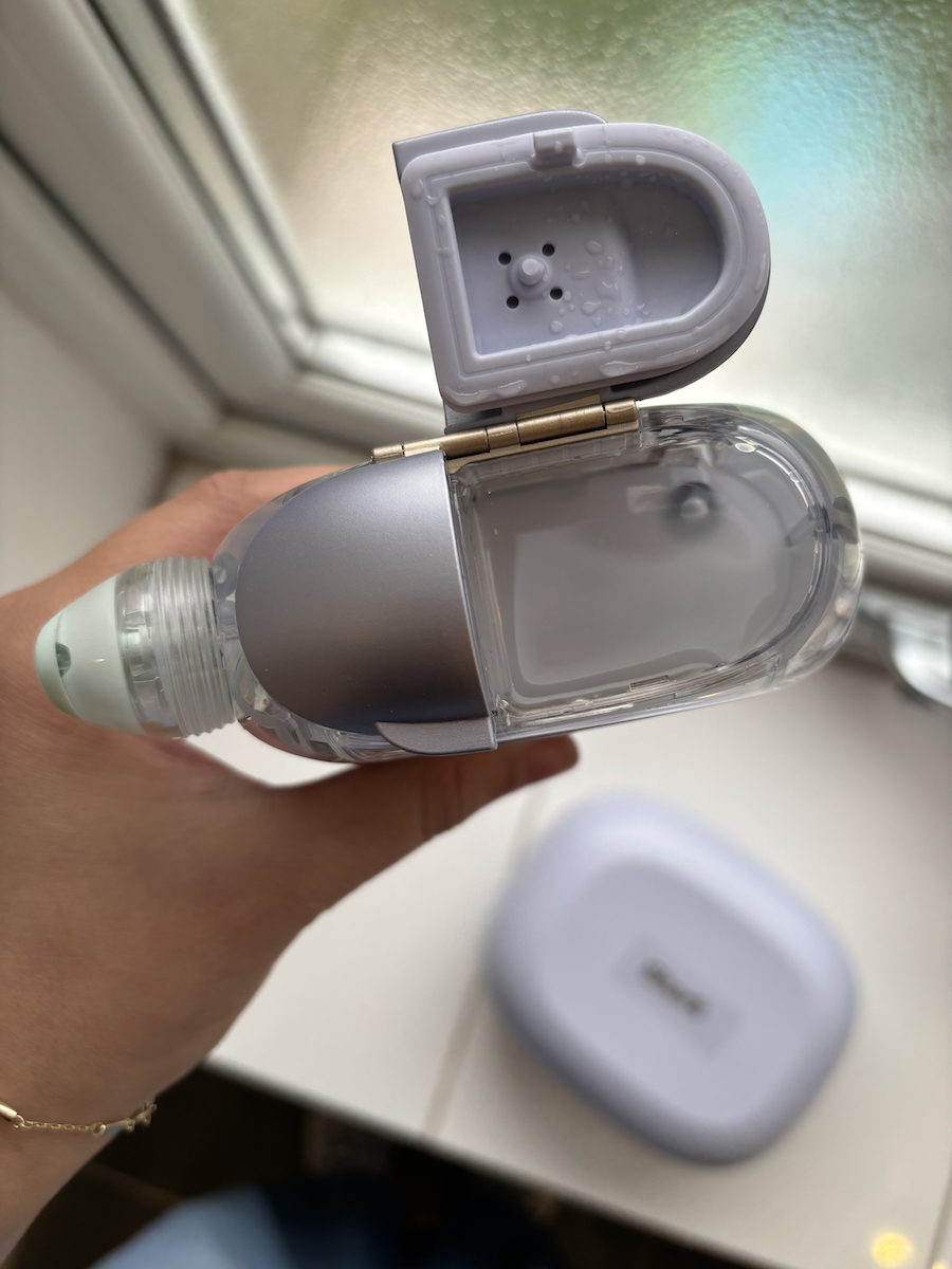 The gunk tank of the Shark Beauty FacialPro Glow + DePuffi