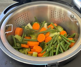 A closeup of vegetables steamed in the Cosori 5-Quart Rice Cooker