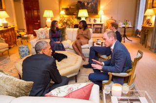 Barack Obama, Michelle Obama, Prince William, Prince Harry and Kate Middleton talking on sofas at Kensington Palace