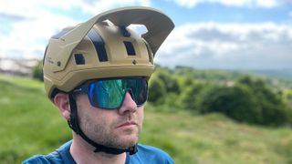 Three-quarter view of rider wearing Sweet Protection Bushwhacker 2Vi helmet