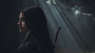 Anya Charlotra as Yennefer in a dark cave in The Witcher season 4