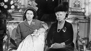 Queen Mary and Princess Elizabeth pose during the christening of Prince Charles