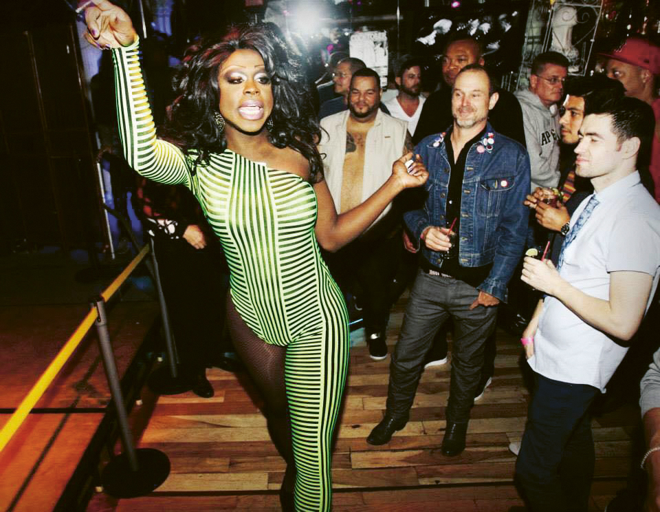 drag queen amid club-goers