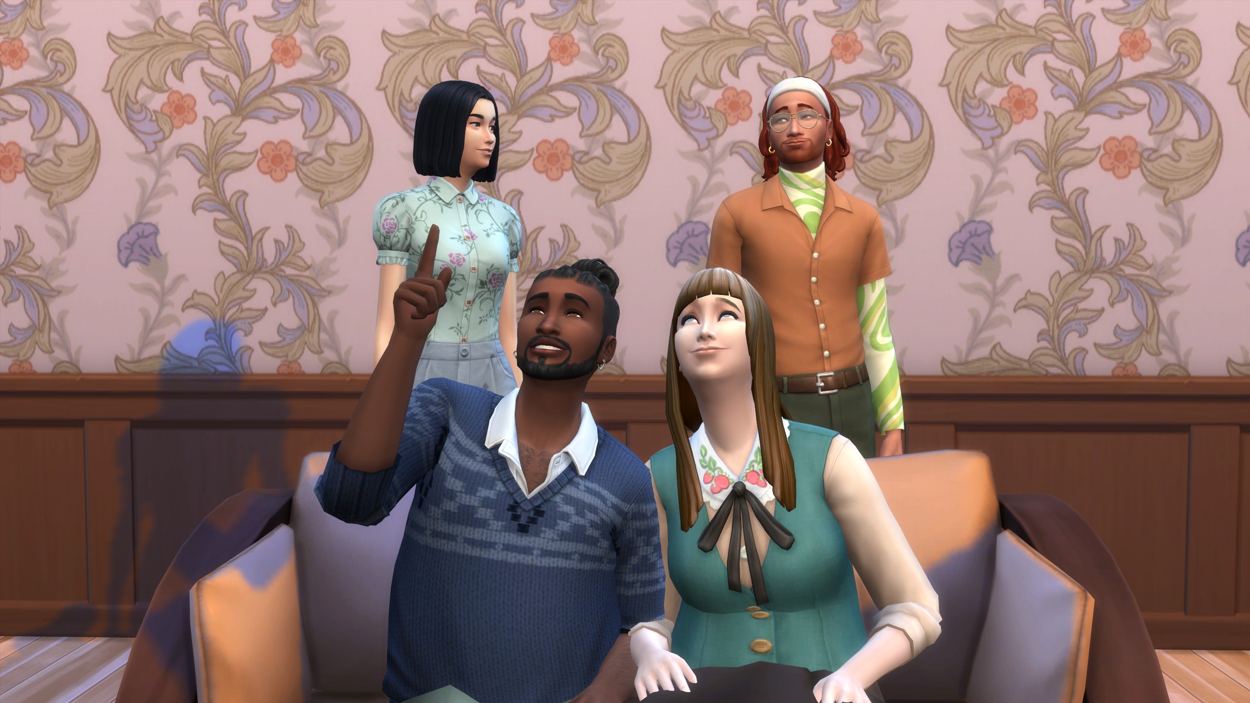 The Sims 4 - Two Sims sit close together on the couch while two others stand behind as friends.