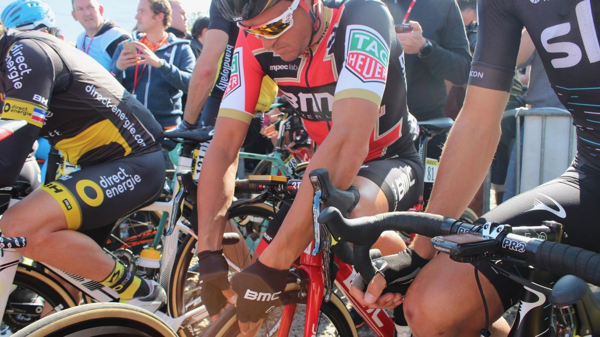 Greg Van Avermaet checks his pressure at the start