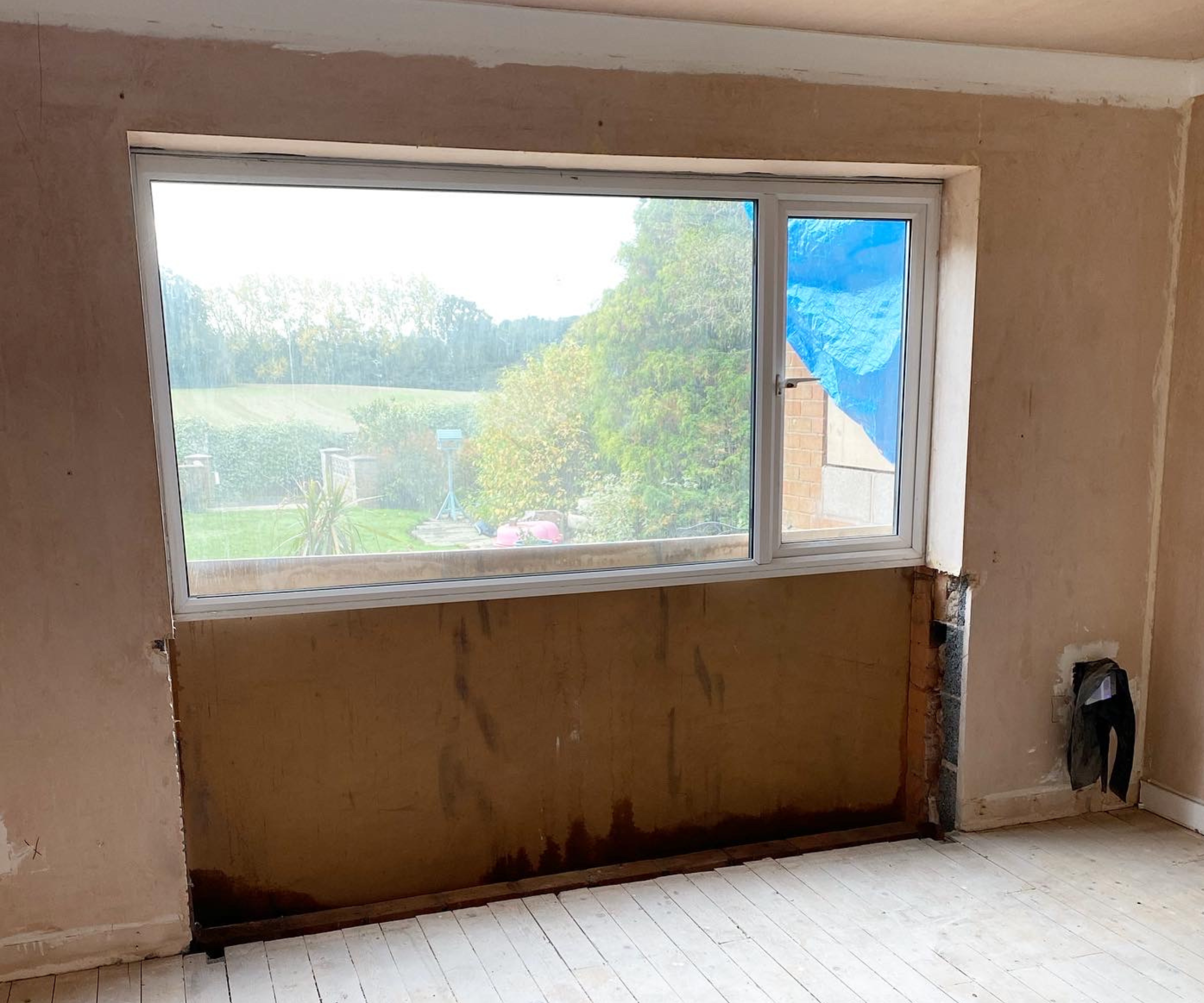 The former window in Laura's living room which overlooks the garden and fields