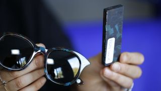 Eyewear, Glasses, Vision care, Finger, Product, Glass, Reflection, Photograph, Display device, Personal protective equipment,