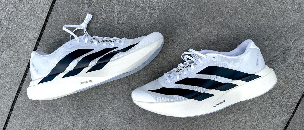 Adidas Adizero Evo SL on a sidewalk