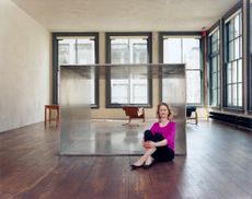 Donald Judd's home and studio in New yORK interior with woman sitting in the middle of the room