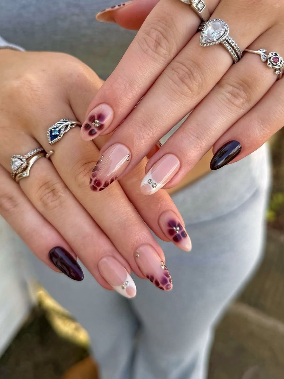 An image showing blooming burgundy nail design, courtesy of @charlotteellennails