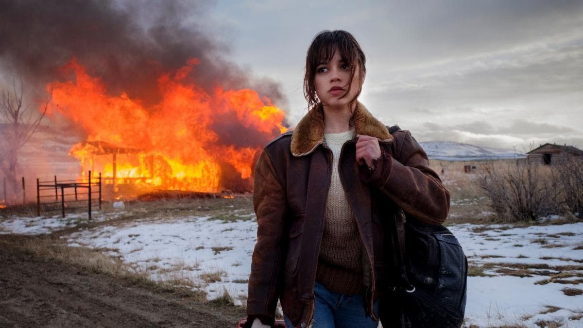Jenna Ortega walking away from a burning building in Hurry Up Tomorrow