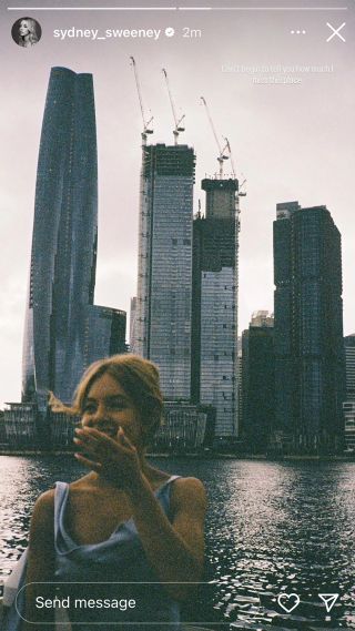 Sydney Sweeney's BTS film photo of herself in front of the Australia skyline while filming Anyone but You