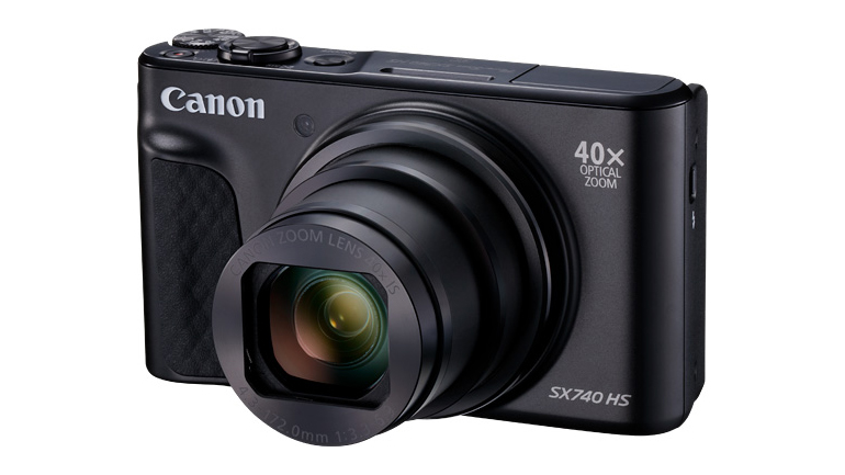 Canon compact camera against a white background