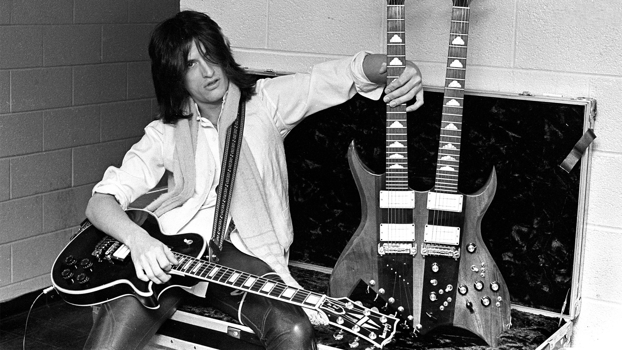 Joe Perry with a Gibson guitar and a B.C.Rich doubleneck backstage at the Boston Garden on November 27, 1978 in Boston, Massachusetts. 