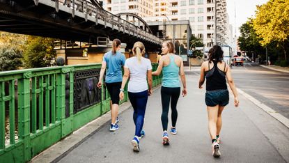 Group of women all walking together as a mood-boosting activity