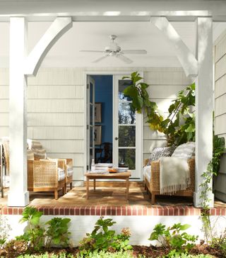 white back porch with patio furniture