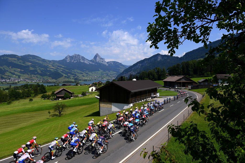 BRUNNEN SWITZERLAND JUNE 15 A general view of the peloton passing through a landscape during the 85th Tour de Suisse 2022 Stage 4 a 1908km stage from Grenchen to Brunnen ourdesuisse2022 WorldTour on June 15 2022 in Brunnen Switzerland Photo by Tim de WaeleGetty Images