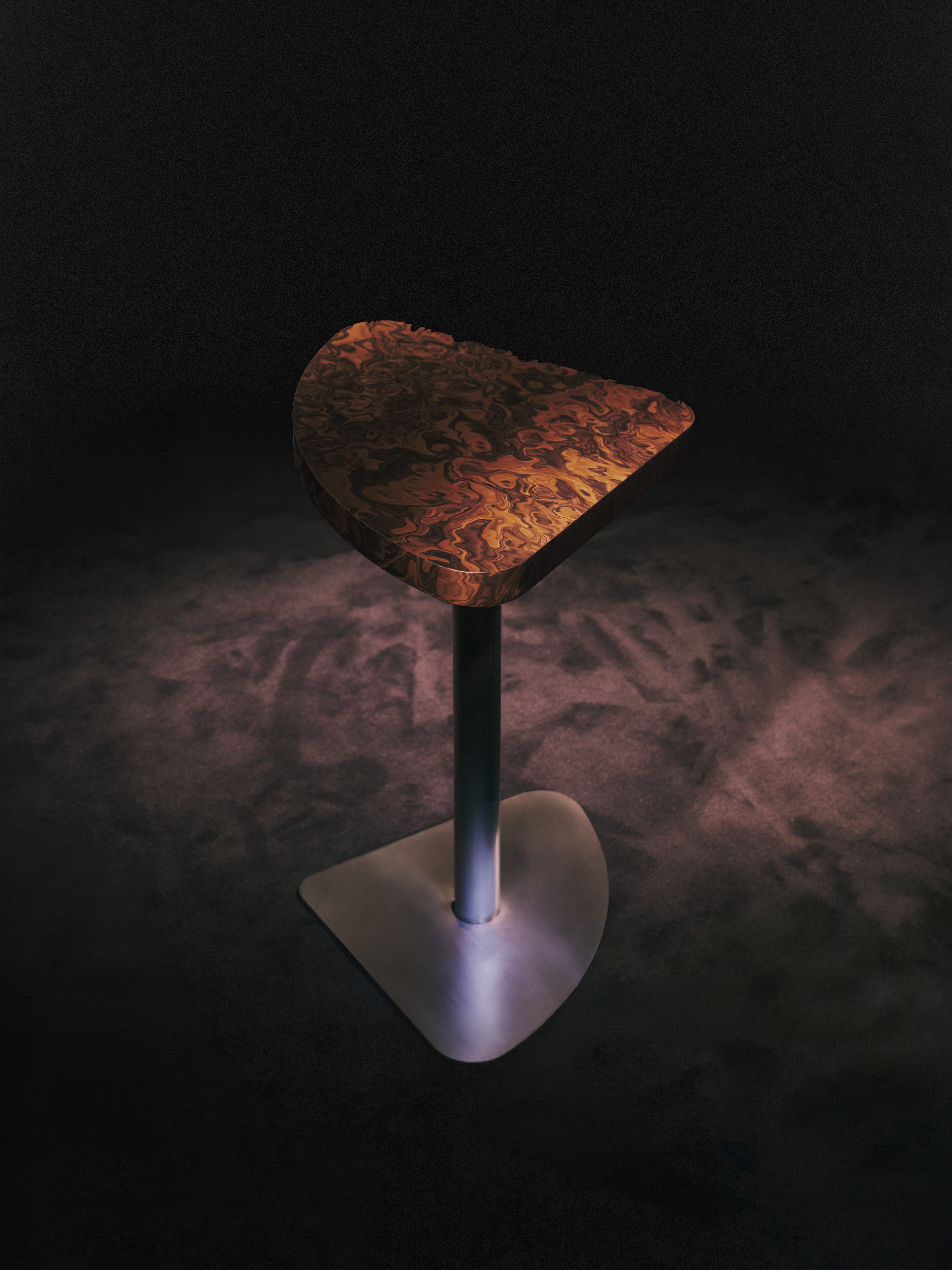 view of an underground bar in london defined by low lighting and velvet textures