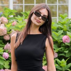 Emily Ratajkowski celebrates Gucci's GG monogram campaign in a little black dress with two Gucci Double-G bags