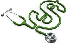 Green stethoscope forming a dollar sign with the tube