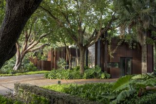 The Coconut Grove Gatehouse by Rene Gonzalez in the greenery