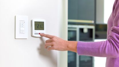 Woman adjusting her heating level