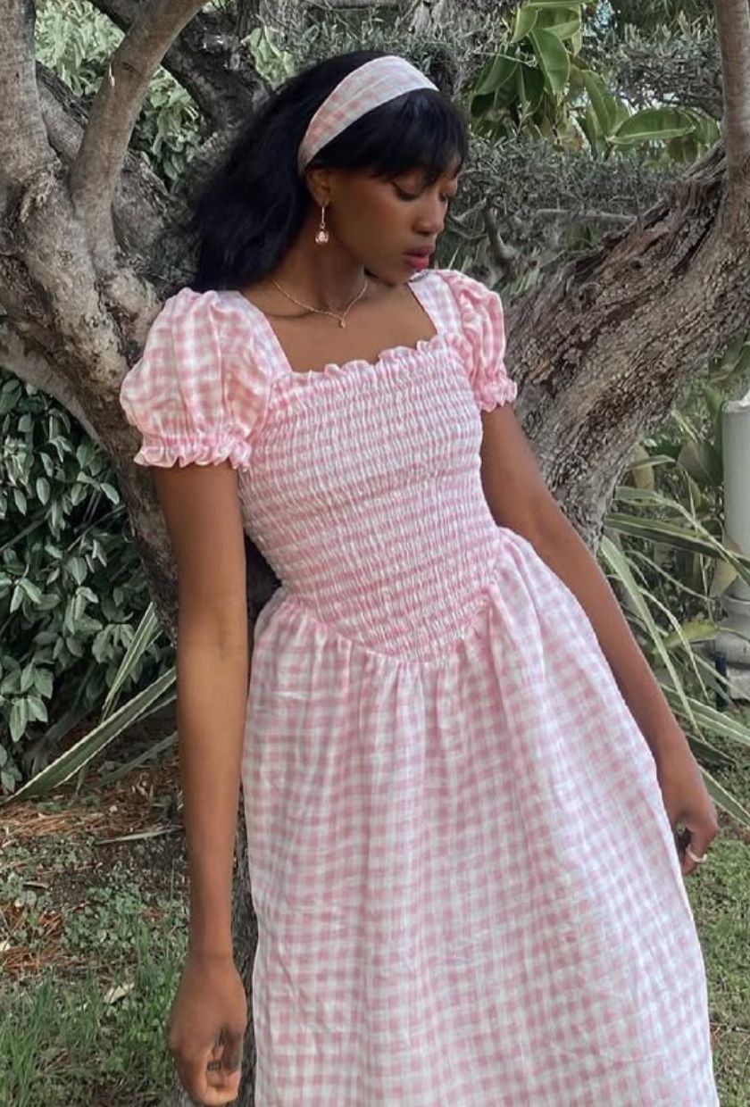 @emmanuellek_ wears a pink gingham puff-sleeve midi dress