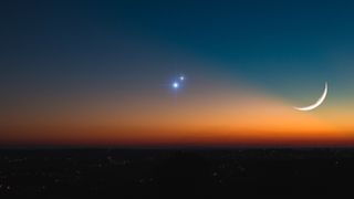 A planetary conjunction alongside a crescent moon