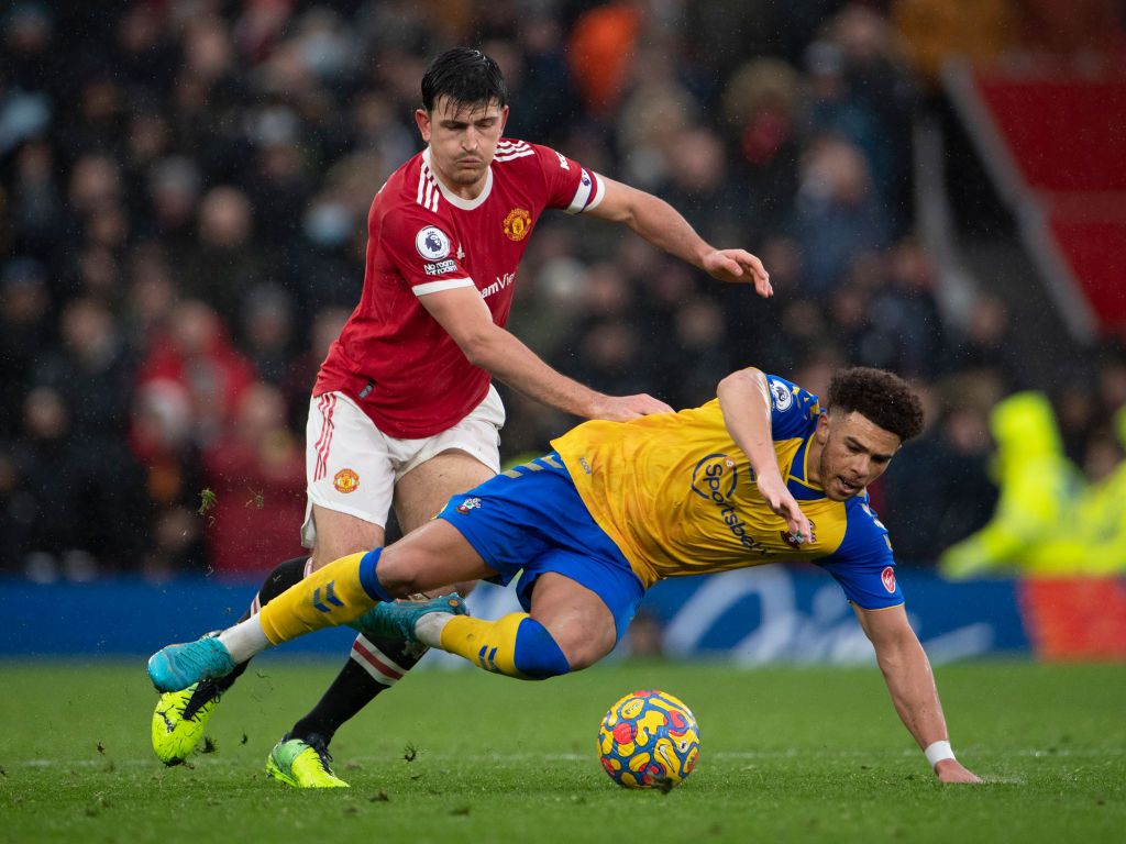 Harry Maguire challenges Che Adams