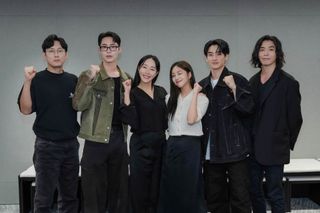 The cast of 'Hong Rang.' poses together and holds up fists