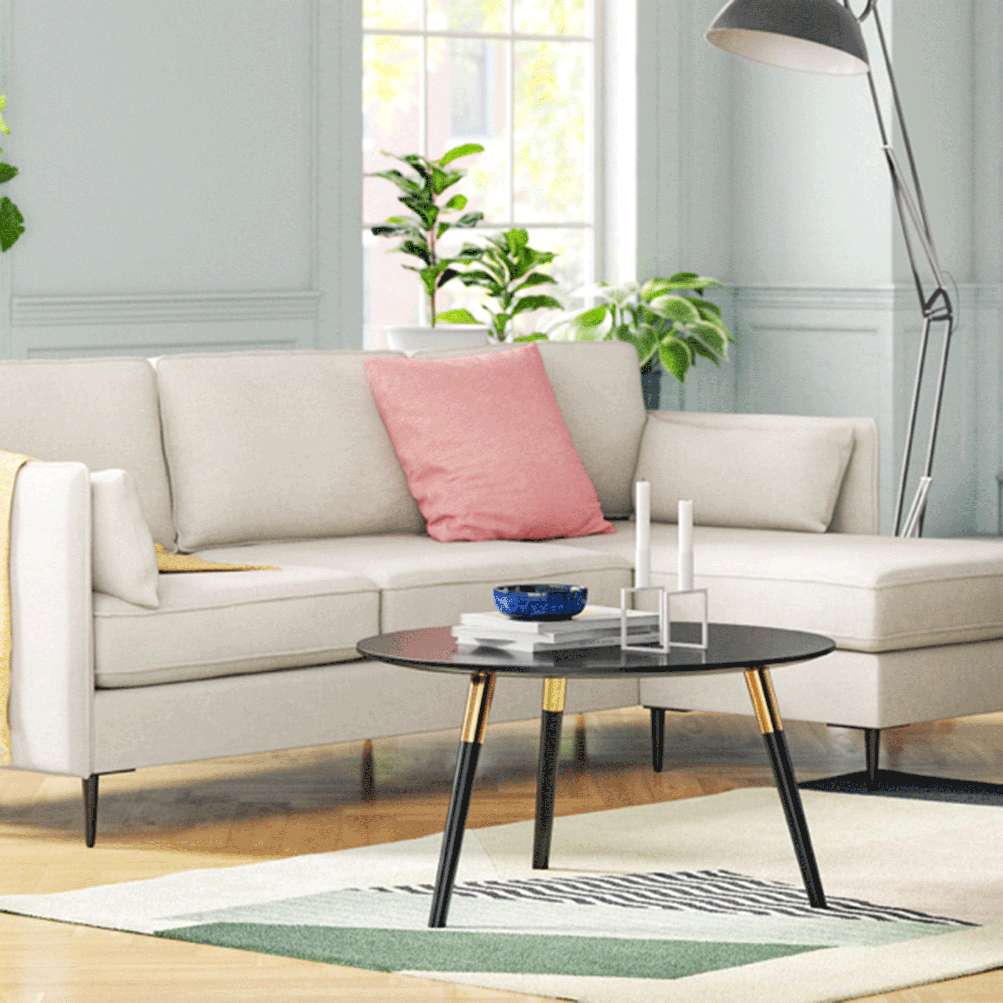 White sofa with pink cushions