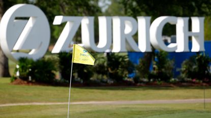 An image of Zurich Classic of New Orleans signage and a flag in one of the holes at TPC Louisiana