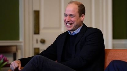 Prince William, Duke of Cambridge smiles as he participates in a discussion as he visits the Foundling Museum